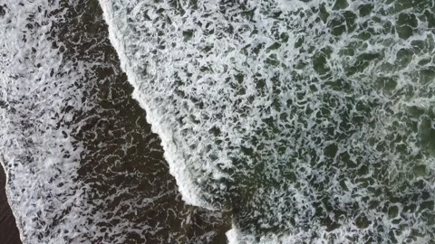 View of the waves and the sand carried by the waves Stock Footage 244855955