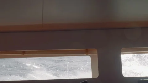 View of waves and splashes from cabin illuminator Stock Footage 86987507