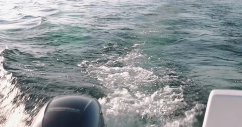 View of waves from the back of a speedboat over the water surface in lake Garda Stock Footage 186339294