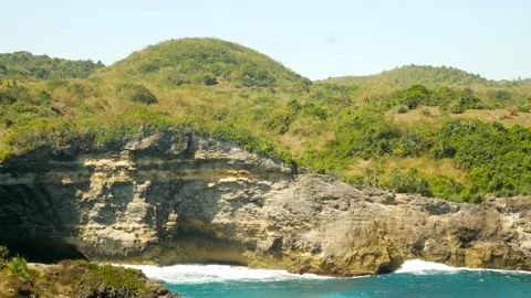 View on waves break on rock cliff Stock Footage 160252961