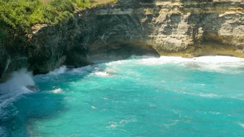 View on waves break on rock cliff Stock Footage 162568586