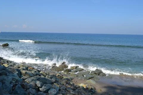 View of waves breaking on the beach Stock Photos
