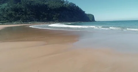 View of waves breaking on a lonely beach Stock Footage 80884160