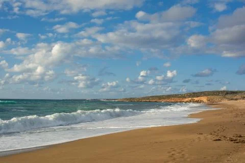 View of the waves breaking on a sandy long seashore. Akamas Peninsula, , Cypr Stock Photos