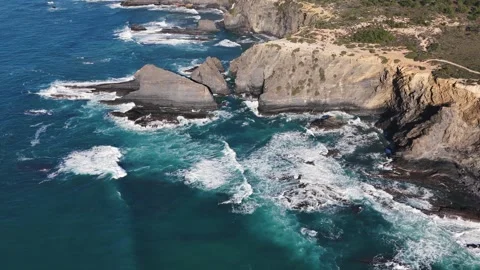 View of the waves crashing on the rocks. Odeceixe Mar Beach, Portugal Stock Footage 265491612