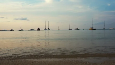 View of Waves Crashing on Sandy Shore. Ship Boats on the Horizon Background 4K Stock Footage 109090434