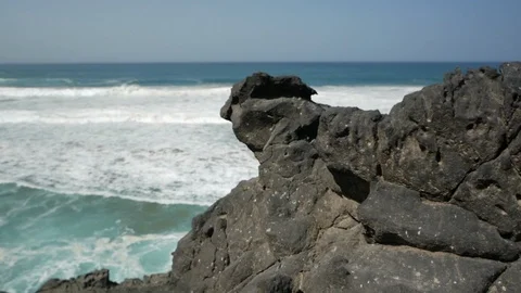 View of waves crashing from the top of a cliff Stock Footage 105066363