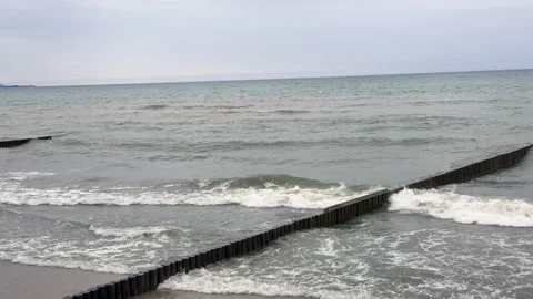 A view of the waves of the gray Baltic Sea on a cloudy day Stock Footage 310605270