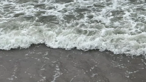 A view of the waves of the gray Baltic Sea on a cloudy day Видео 310605572