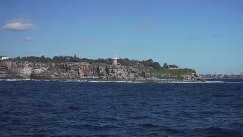 View of waves of the ocean with generic island as background Stock-Footage 86167686
