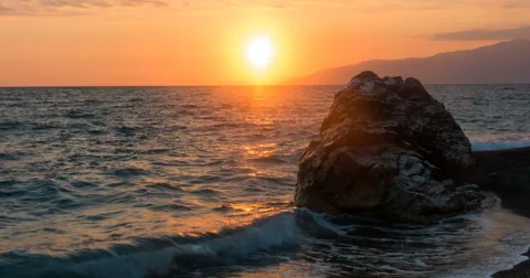 View of Waves Rolled at Sea Coast Line With Huge Rock at Sunset Time Lapse With Stock Footage 68946018