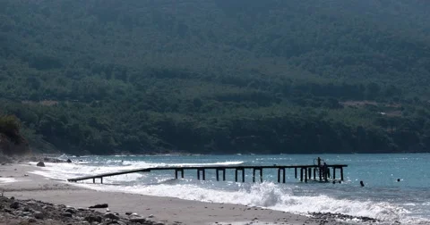 View of Waves at Sea Coast Line With Pier at Summer Day Vidéo 69032408