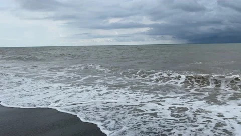 View of the waves before the storm. Storm cloud. Black sand on the beach Stock Footage 136764455