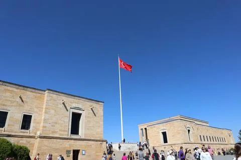 View of waving Turkish flag between the buildings at Anitkabir museum Stock Photos