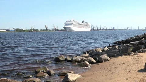View of wavy river with approaching large white cruise liner Stock Footage 110845115