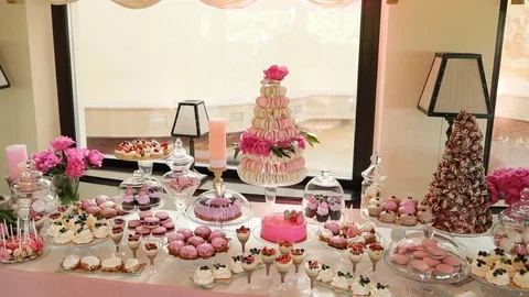 View of wedding stylish colorful candy bar in the restaurant. View from the side Stock Footage
