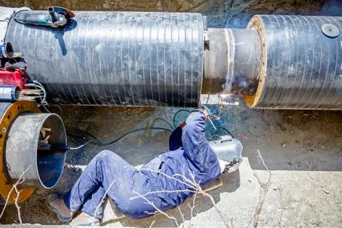 View on welder until welding pipeline Stock Photos