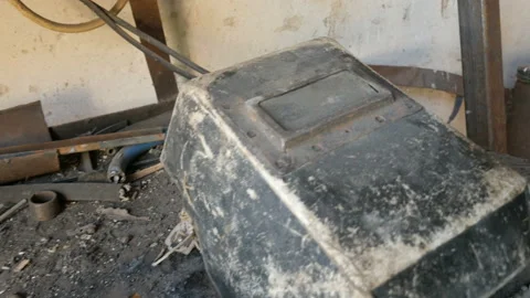 View of welding mask and tools used by the welder on workbench. Workshop Stock Footage 88938400