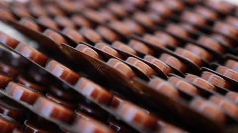 View of well arranged packets of brown tablets Stock Footage 147699479