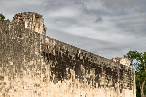 View of the west wall with stone ring marker at the Great Ball Court in Chichen Stock Photos