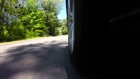 View on the wheel of the car while driving Stock Footage 75393310