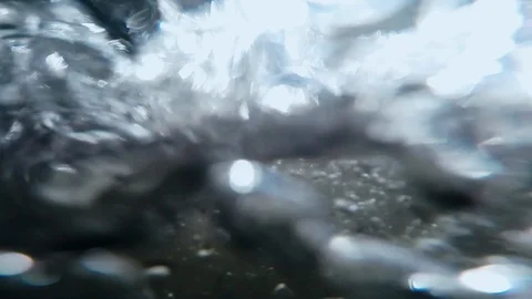 View of the wheel under water. Auto travel: SUV moves across a deep river flow Stock Footage 110325484