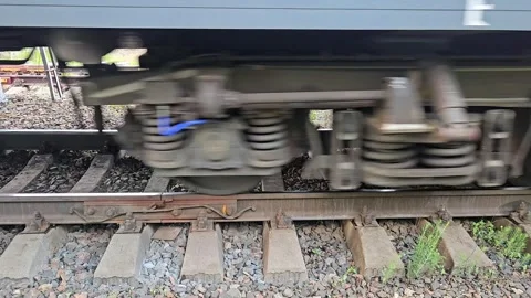 A view of the wheels of a passing train on a railway 库存影片 342558354
