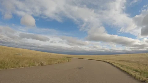 View when pulling into a parking lot in a grassland park. With a beautiful sky. Stock Footage 287107040