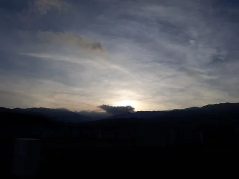 The view when the sun goes down on the slopes of the mountains Stock Photos