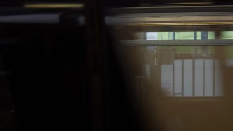 View while metro public train commuter passing moving fast through train st.. Stock Footage 283054497