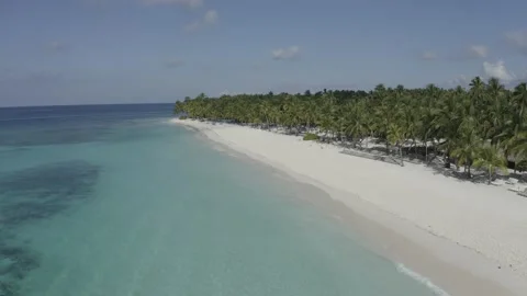 View of the white beach and water from a flying drone. Stock Footage 140886291