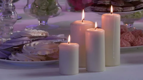View of white candles on dessert table Stock Footage 44016665