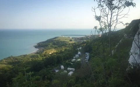 View at white cliffs of Dover, grass, trees and rocks Stock Photos