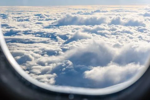 View on white clouds from the airplane window Stock Photos