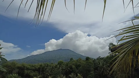 View of white clouds over the mountain during the day 動画素材 195974845