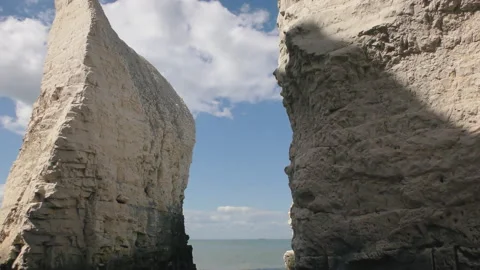 A view of white clouds over white rocks. Britain. Stock Footage 90220680