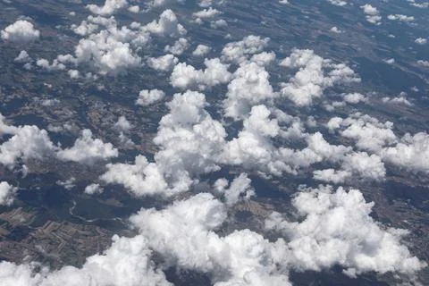 View of white clouds seen from the plane window Stock Photos