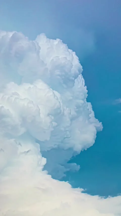 View of white cumulus clouds against a blue sky in Latvia. Видео 339951361