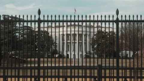 View of The White House in Washington, DC from behind a fence Stock Footage 245753322