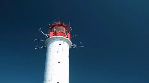 View of white lighthouse on pier. Black Sea Stock Footage 102485767