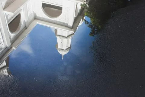 View of the White Mosque with water reflections on the road Stock Photos