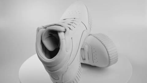 View of white Puma sneakers isolated on ... | Stock Video | Pond5