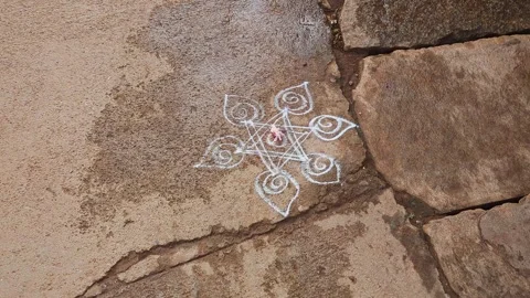 View of white rangoli design outside home showcasing simple traditional flo.. Stock Footage 335873285
