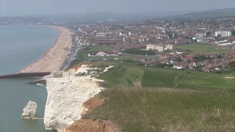 A view of the white rocks and the sandy beach of Seaford. England. Video stock 82910493