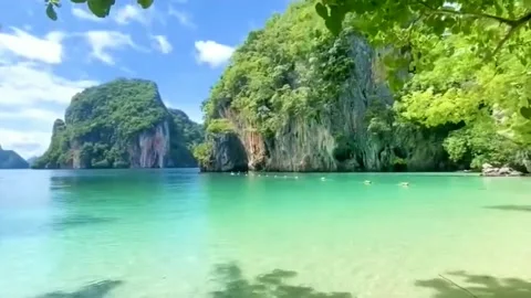 View of white sand beach and green sea water and many islands Stock Footage 203933517