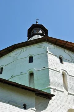 View of the white stone tower of the monastery. Stock Photos