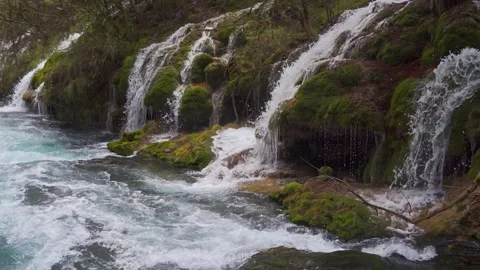 View of White Water Cascading Over Mossy Travertine Rocks of Jiuzhaigou Stock-Footage 334122429