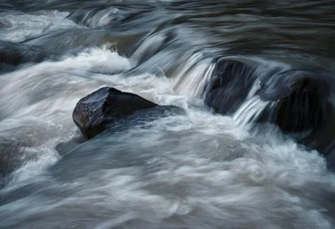 View of the wild water of the river Stock Photos