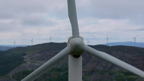 A View of Wind Turbines Arrayed Along the Hilltop Stock Footage 281642147