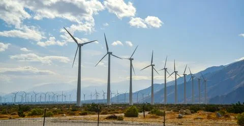 View of wind turbines generating electricity. Huge array of gigantic wind tur 写真素材